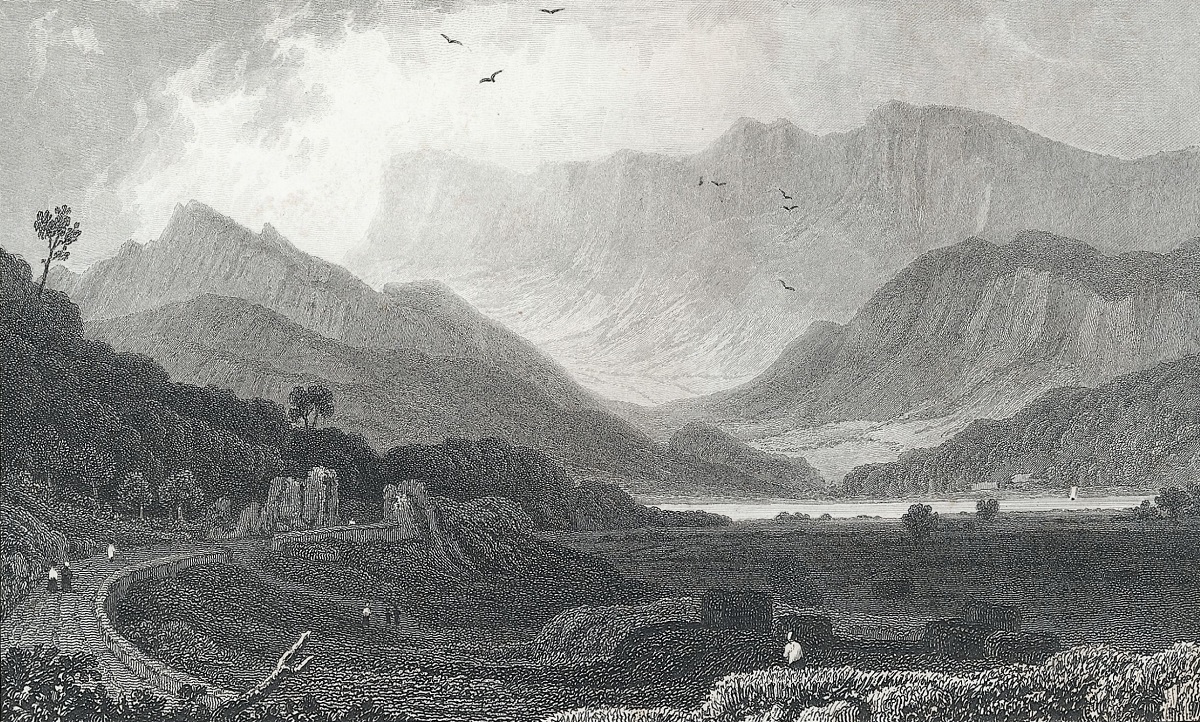 A view of the Mowddwy valley flanked by the rugged and steep rockface of Cader Idris in the background.